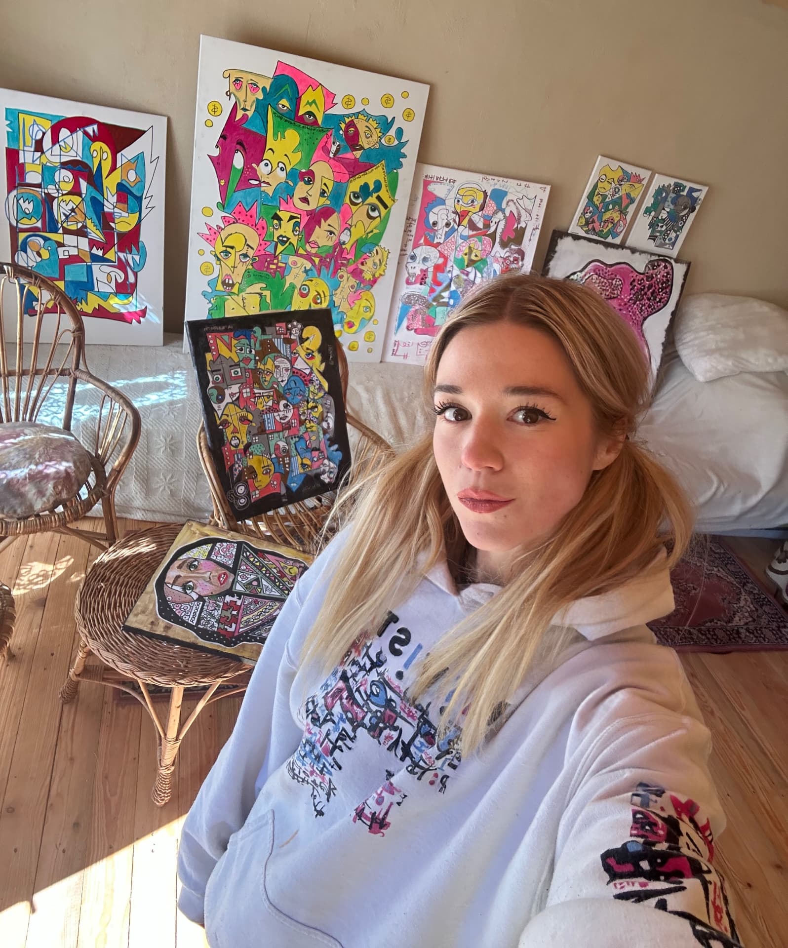 Aneta Kernová surrounded by her canvases